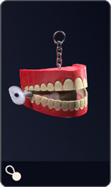 File:Chattering Teeth Charm.png